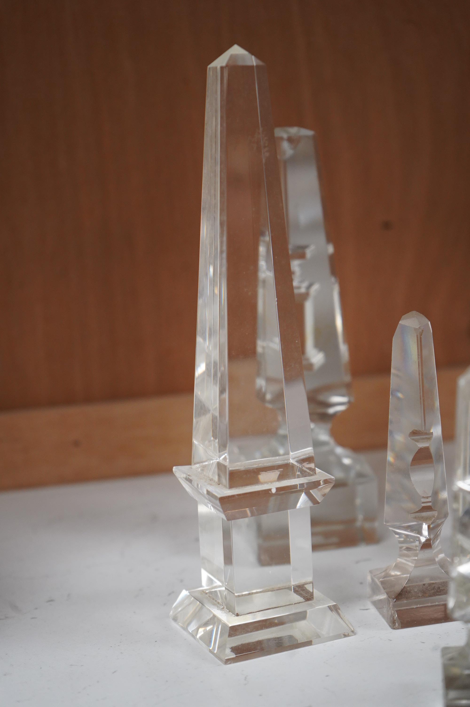 Twelve Victorian glass deceptive obelisks, and two later glass obelisk ornaments, largest pair 21cm high